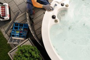 Technician servicing a hot tub