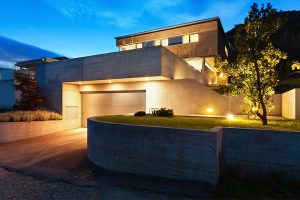 Modern house with outdoor lighting at dusk