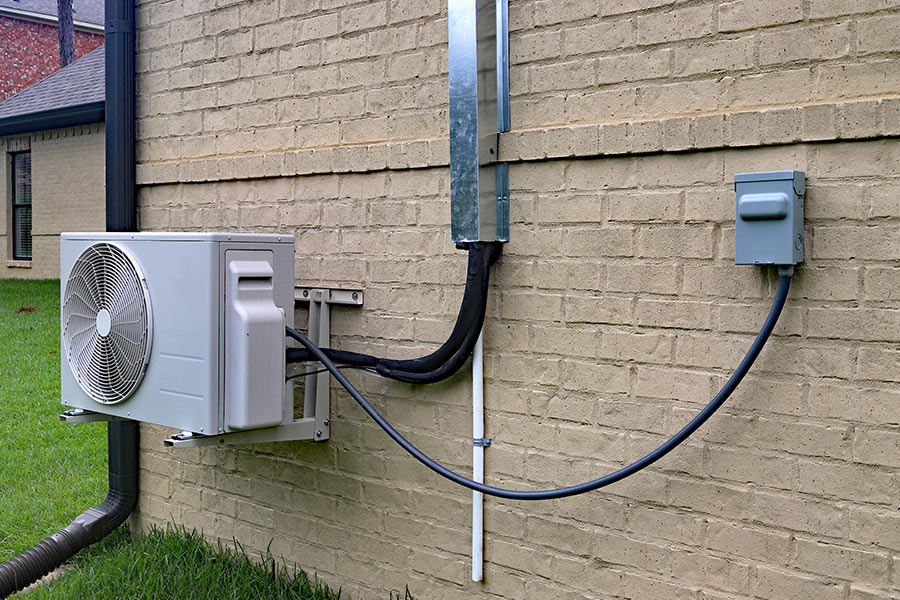 Outdoor air conditioning unit connected electrical cables