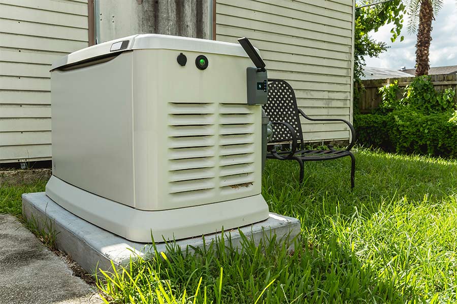 Outdoor residential generator installed on a concrete pad