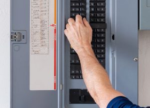 Person operating a circuit breaker panel